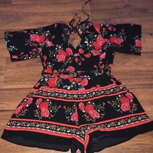 Size M black romper with red flowers and designs